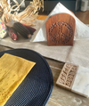 Carved peace sign napkin holder