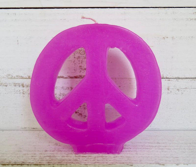 Pink peace sign candle