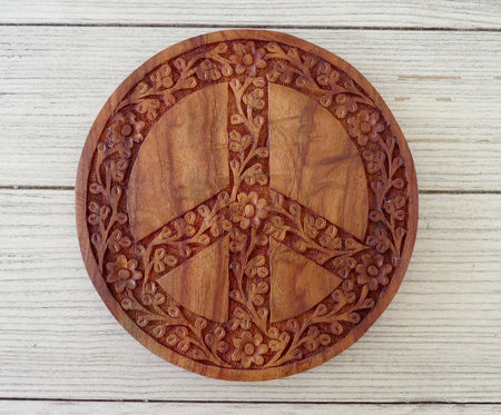 Carved peace sign trivet