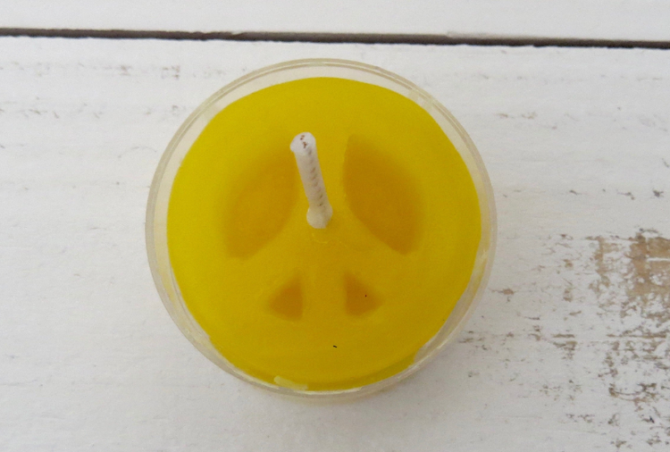 Yellow peace sign candle