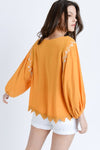 orange embroidered top