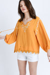 orange embroidered top