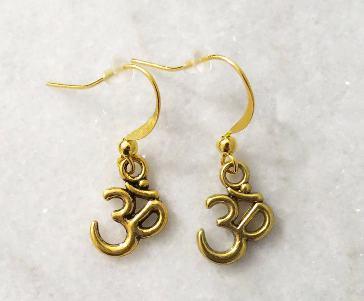gold OM earrings